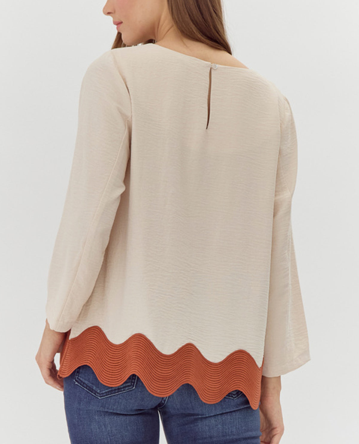 U-Neck Top with Ribbed Swirl Hemline