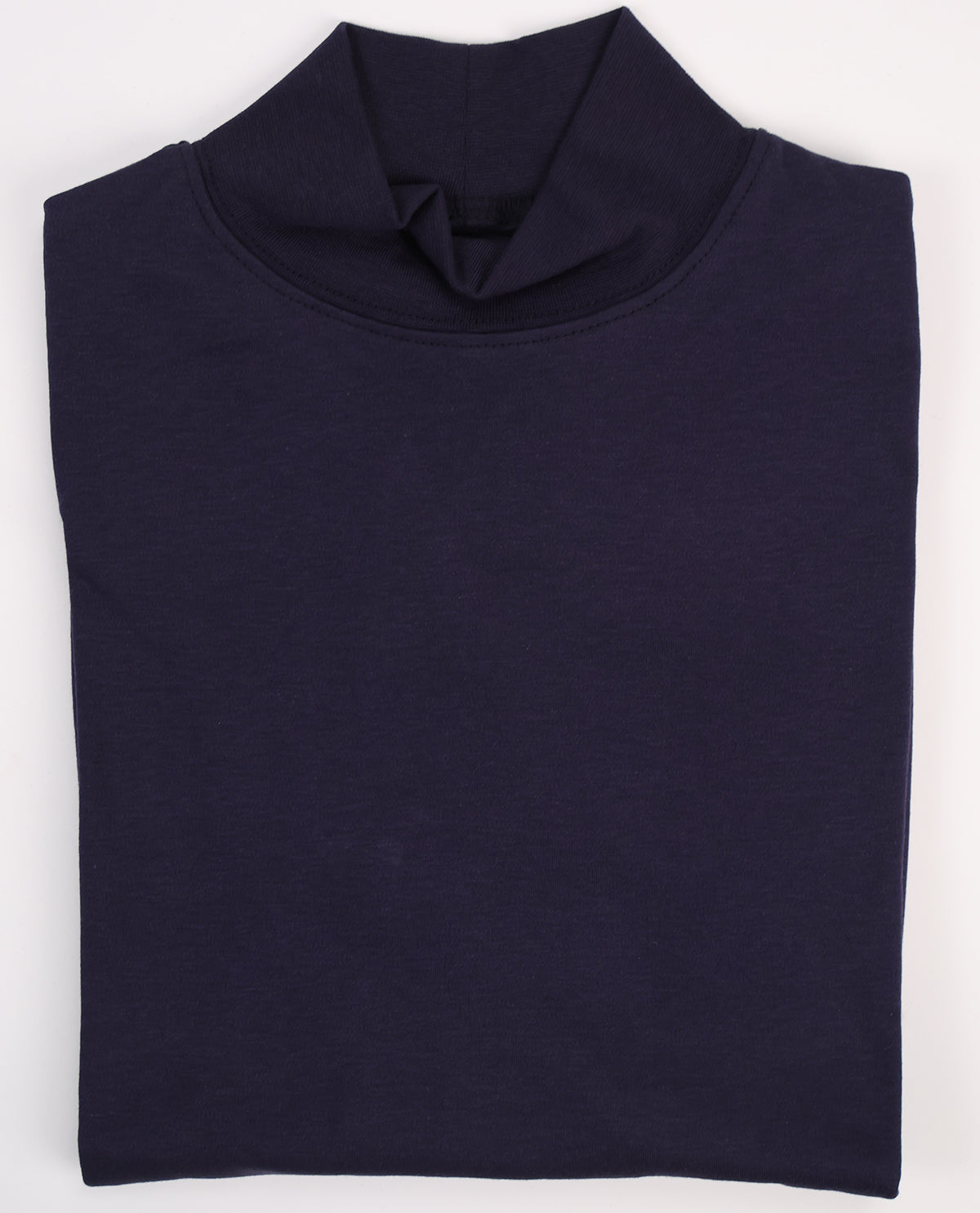 Folded navy blue turtleneck sweater on a white background