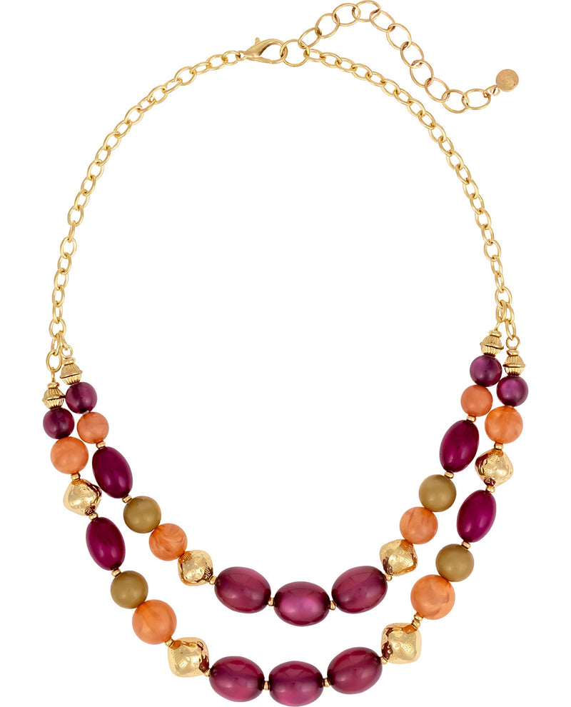 A multi-strand statement necklace featuring oval beads in deep magenta, orange, and olive green, accented with textured gold-tone beads and a gold-tone chain.