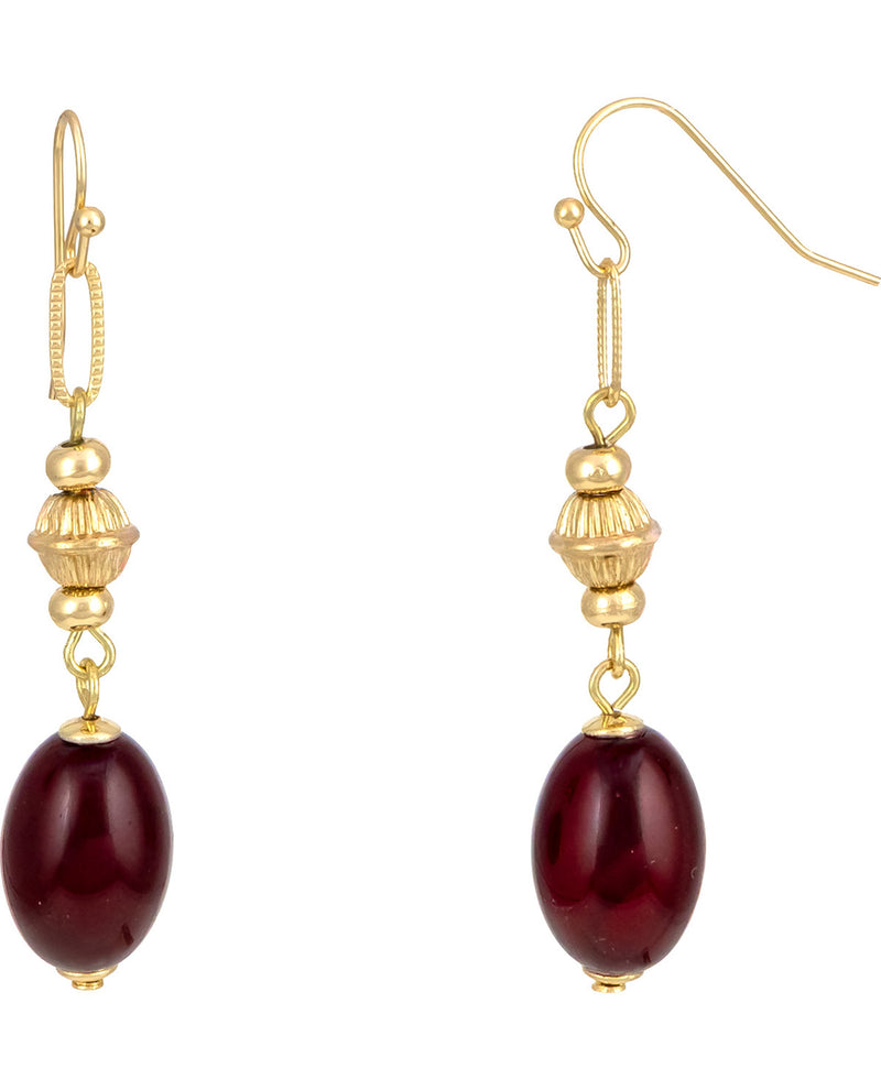 A pair of gold dangle earrings with textured gold beads and oval dark red gemstone drops, shown against a plain white background.