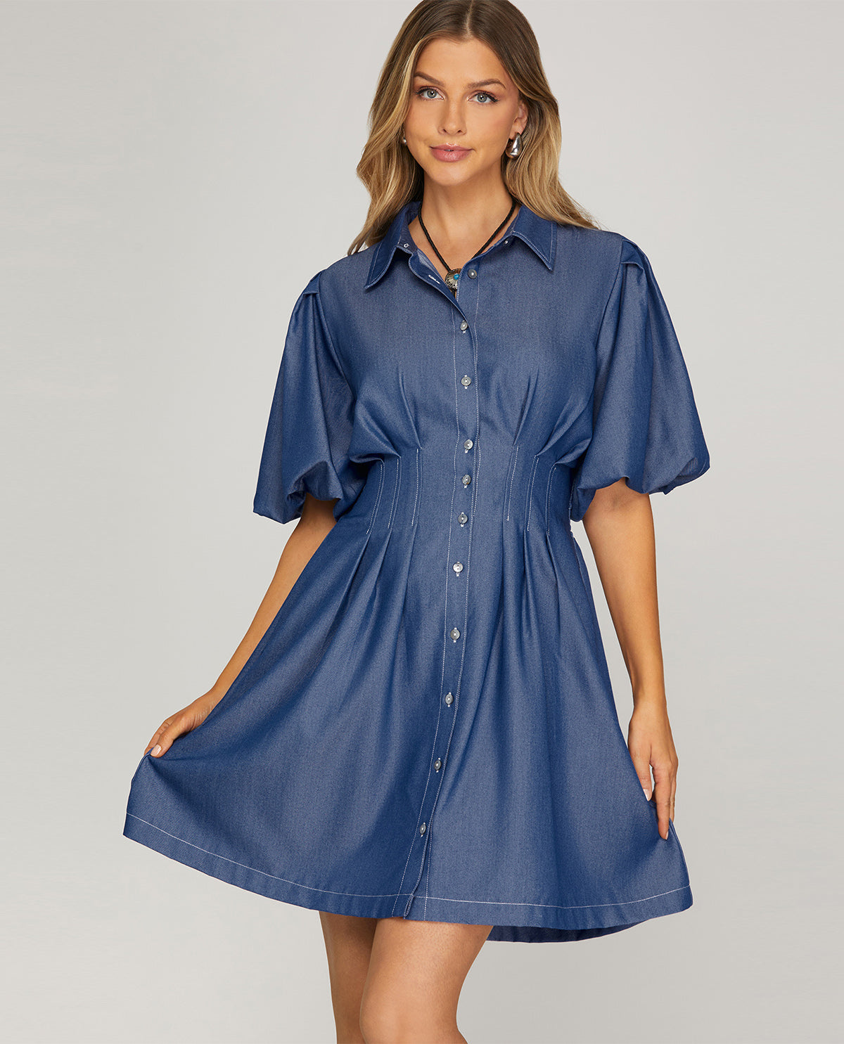 Missy model wearing a short sleeve mini denim blue dress