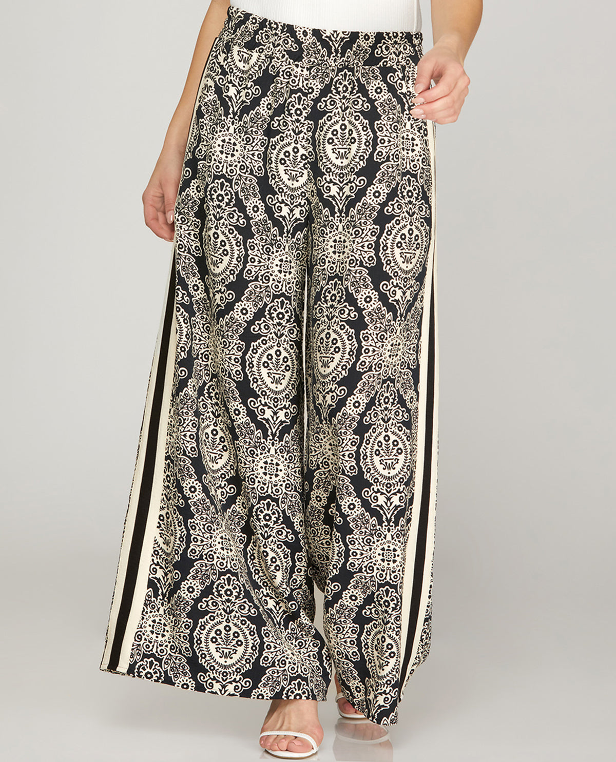 Black and white patterned pants on a plain background