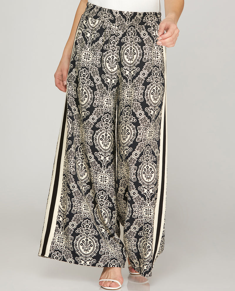 Black and white patterned pants on a plain background