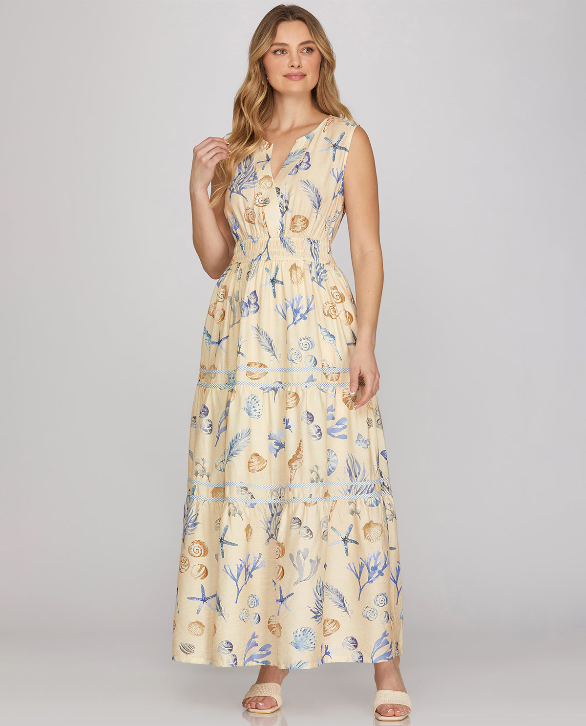 Woman wearing a floral dress with a neutral background