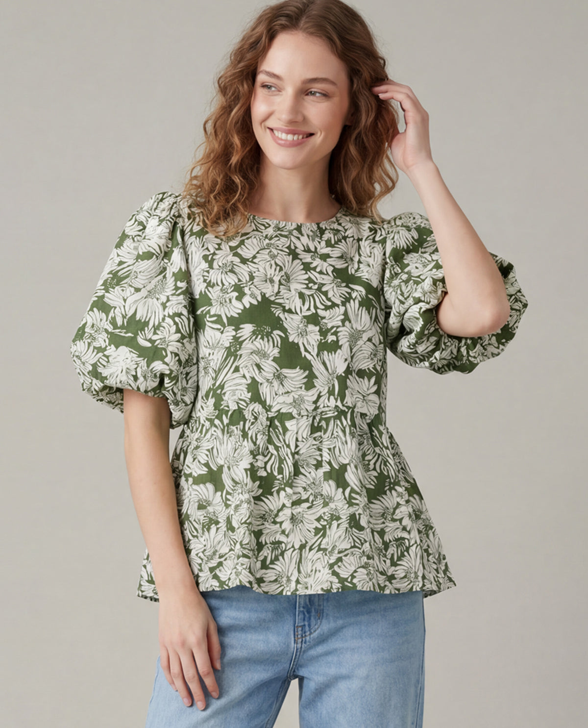 Missy model wearing a short sleeve olive floral print blouse