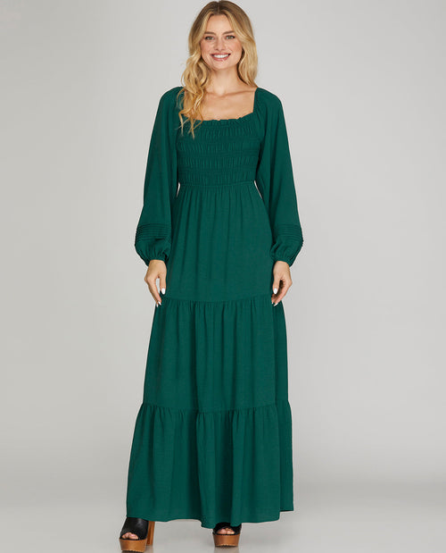 Missy model wearing a long sleeve green maxi dress
