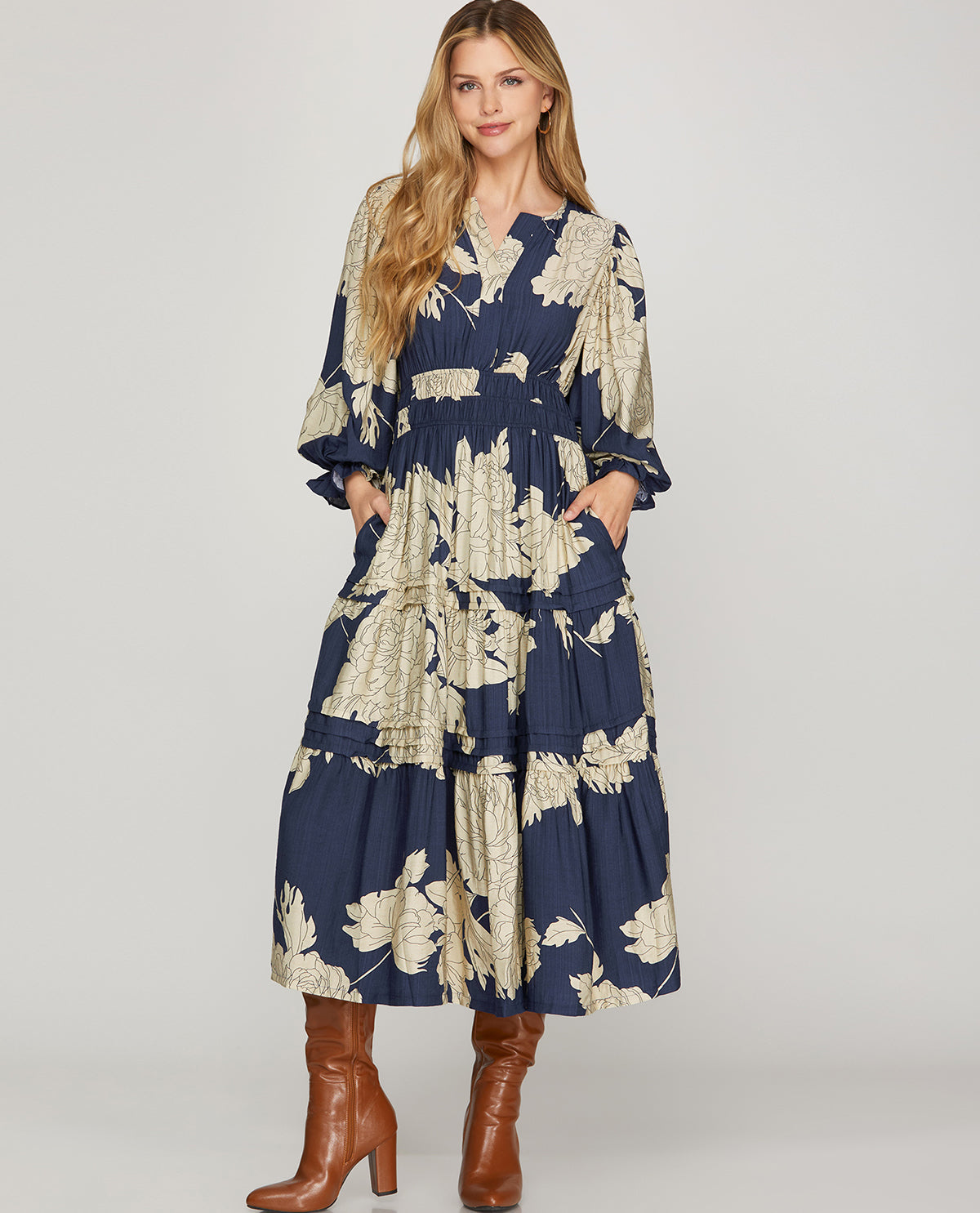 Missy model wearing a long sleeved navy floral maxi dress with pockets