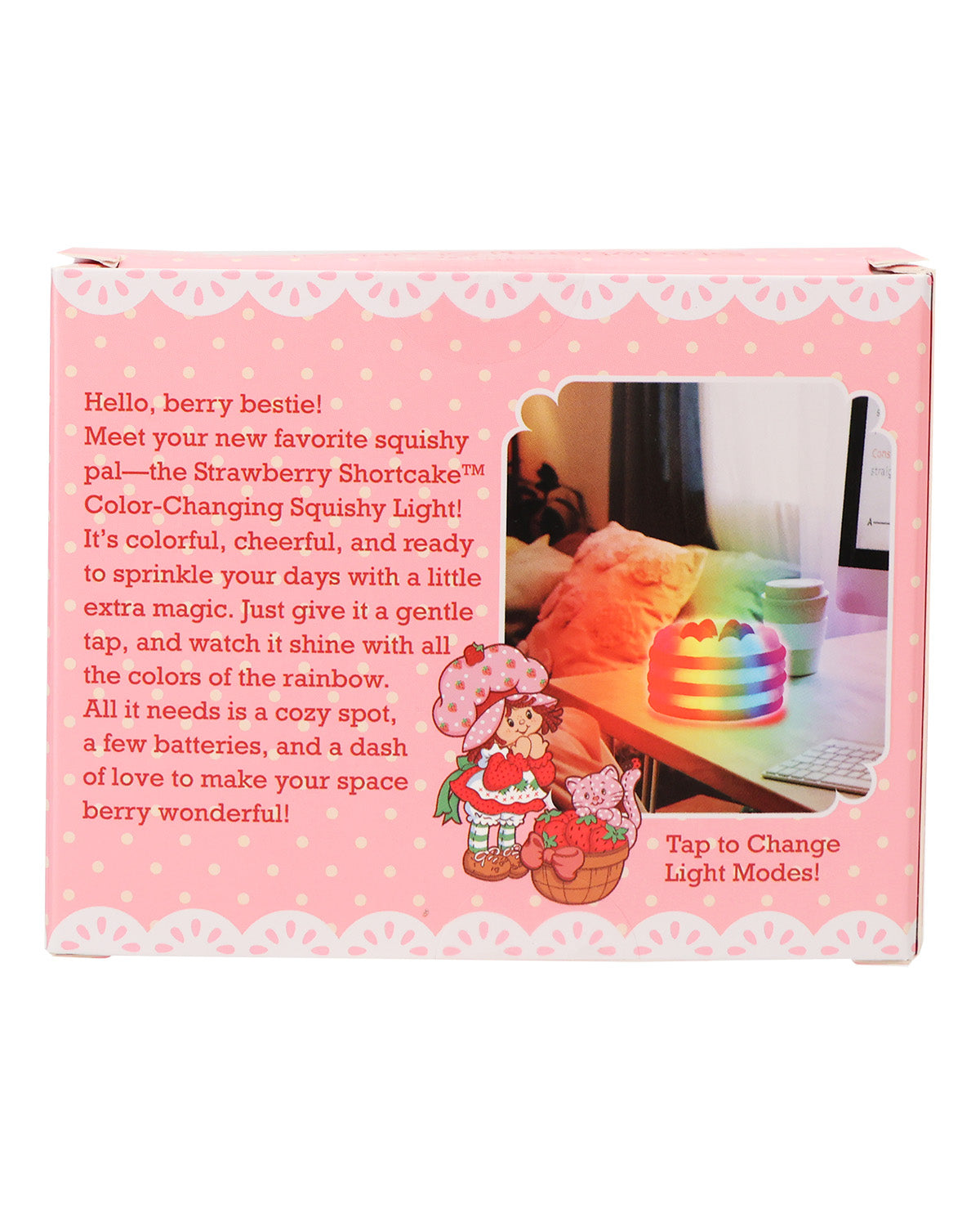 Pink product packaging box for a color-changing squishy light toy, featuring a photo of the glowing rainbow squishy on a desk, cute character illustrations, and product description text.