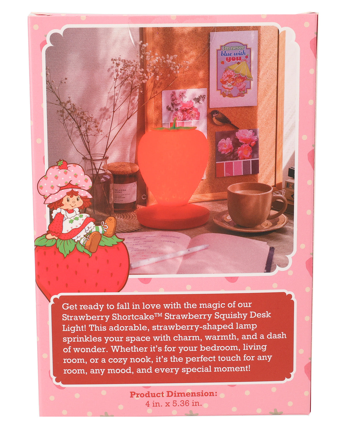 Pink Strawberry Shortcake-themed desk light box packaging, featuring an illustration of the character in a strawberry hat, a strawberry-shaped orange lamp, and product description text on a pink background.