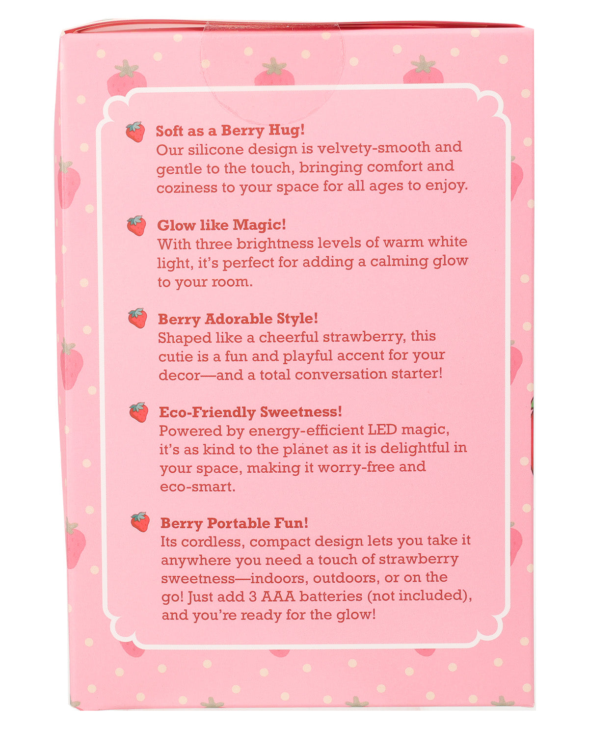 The back of a strawberry-themed product box with a pink background, white border, and red text describing features like soft silicone touch, warm white glow, adorable strawberry shape, energy-efficient LED light, portable compact design, and suitability for indoor/outdoor decor.