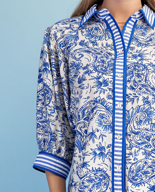 Blue and white patterned shirt on a blue background