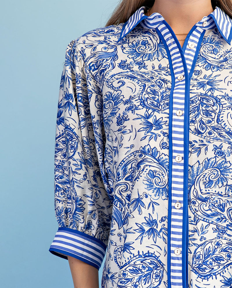 Blue and white patterned shirt on a blue background