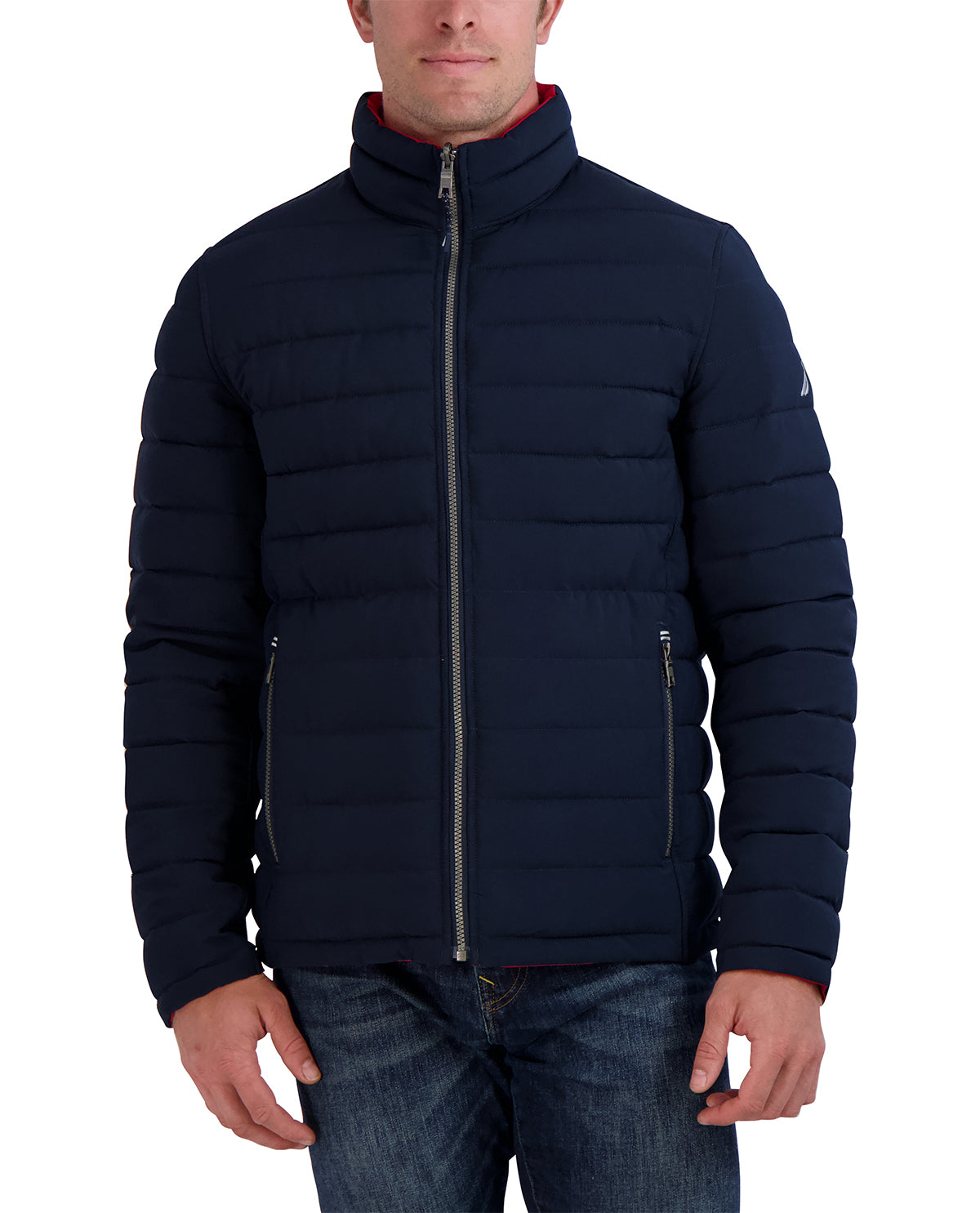 Man wearing a navy blue puffer jacket on a white background