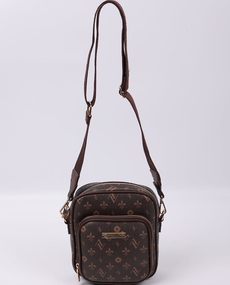 Brown patterned crossbody bag on a light gray background