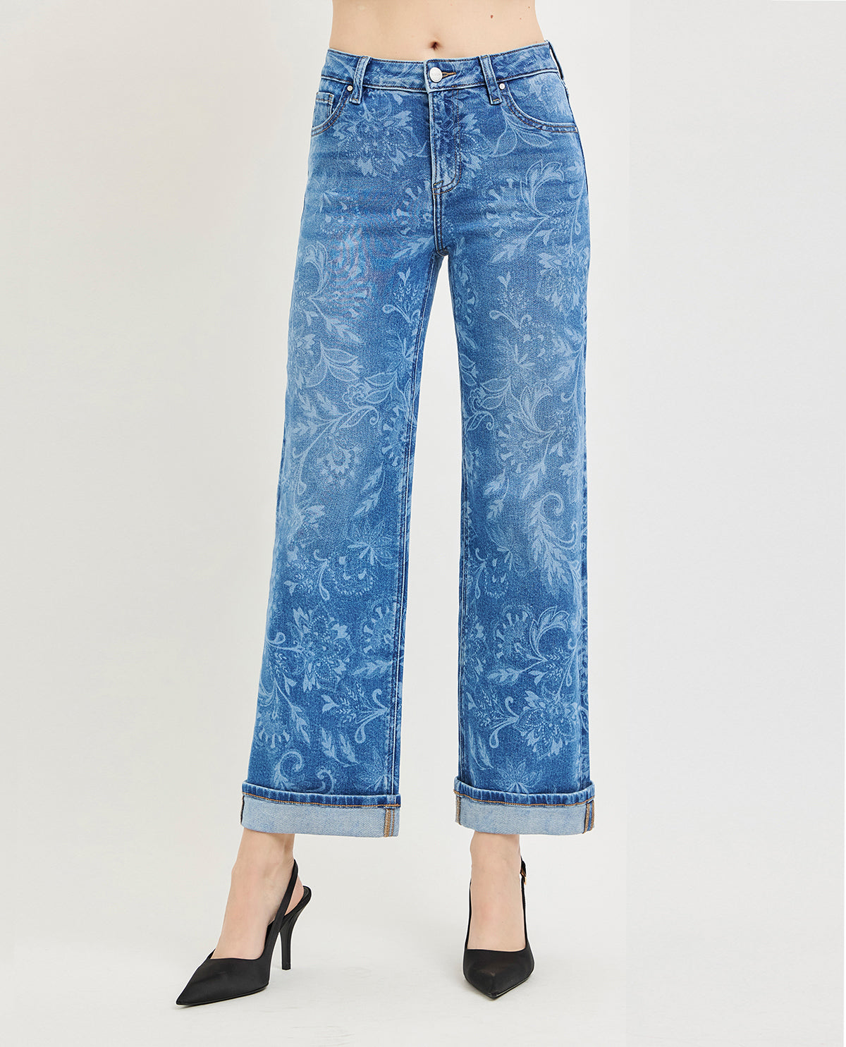 Blue floral-patterned jeans on a white background